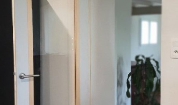 Pose d'une porte vitrée en bois dans une maison à Langon